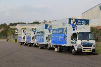 4 Plumbing Trucks Lined Up